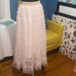 Elegant Pink Ruffled Skirt size small have elastic waist can fit up to a large